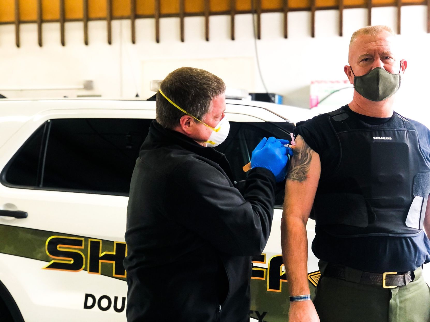 Douglas County Sheriff John Hanlin receives the COVID-19 vaccine
